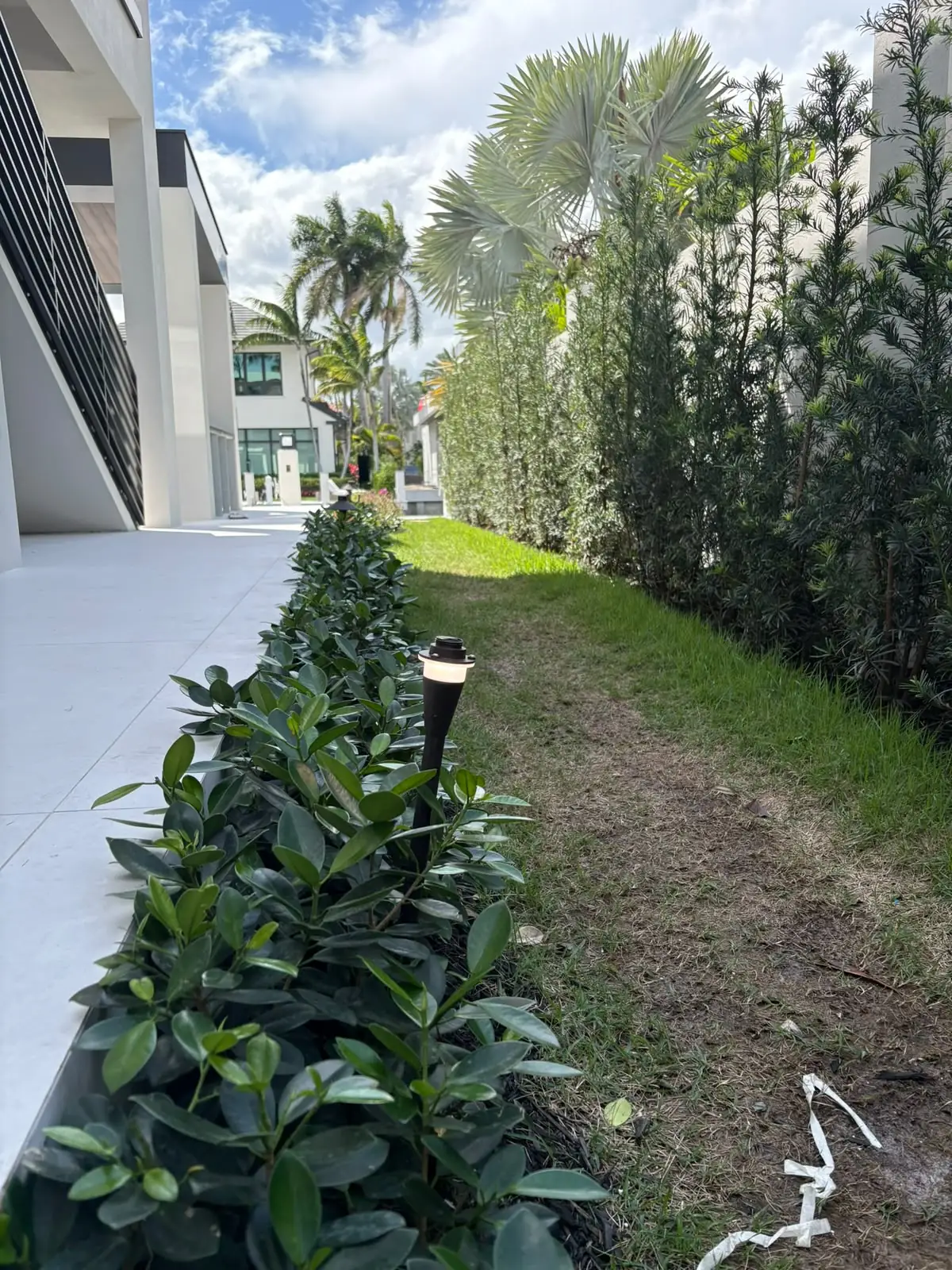 Low-voltage path lighting along a residence